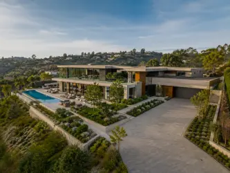 Luxury private estate with landscaped grounds and a swimming pool, representing estate management for a private household.
