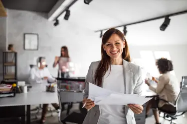 Family office recruitment professional reviewing candidate documents, representing specialist hiring for private office roles.