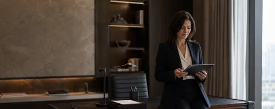 Recruitment professional reviewing documents, representing trust-led hiring for UHNW private staff and family office roles.