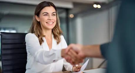 Candidate completing a professional registration process during a meeting with a private staffing consultant.